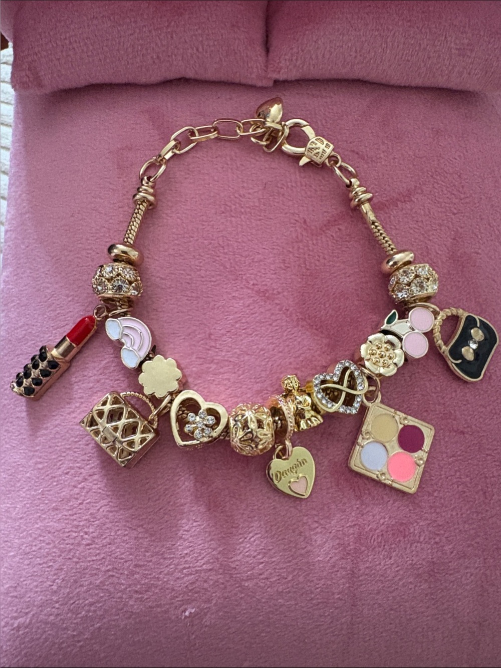 Gold-Tone Charm Bracelet with Pink and Black Accents girls or teenagers